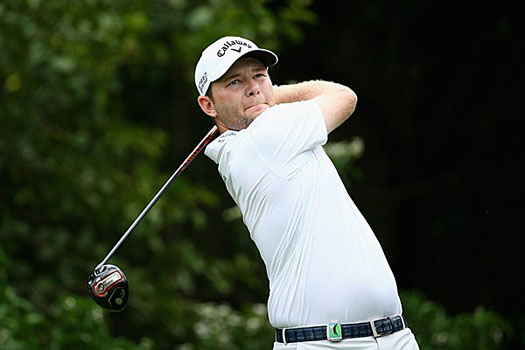 Branden Grace battles hard for a third round 72