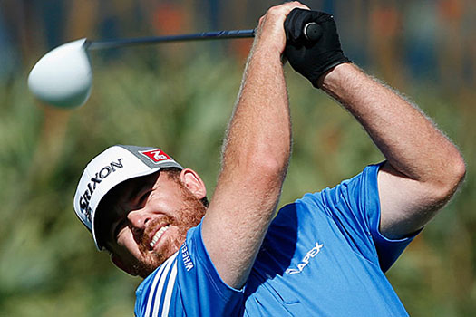 J.B. Holmes cards seven birdies and one bogey