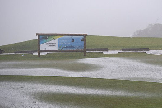 Heavy rain which flooded the course