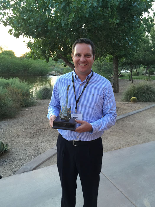 Scott McCaw, Director of Club Operations, proudly shows off Saadiyat Beach Golf Club’s Rockstar Award