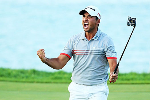 Day reacts after holing a 24-foot birdie at the par-three 17th